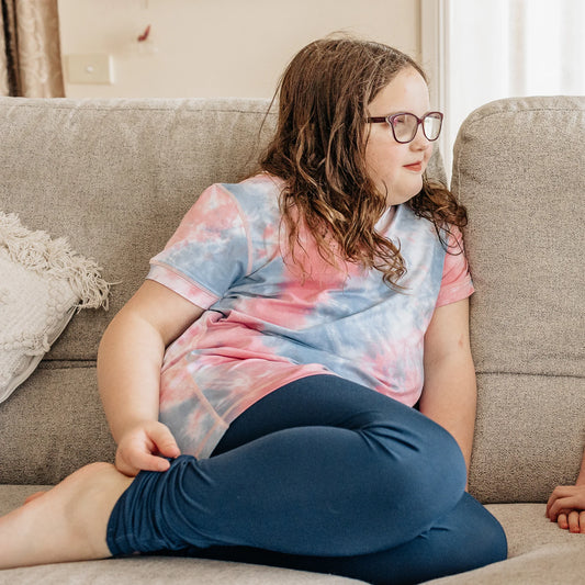 Comfort_On_The_Spectrum_Leggings_navy_girl_sitting