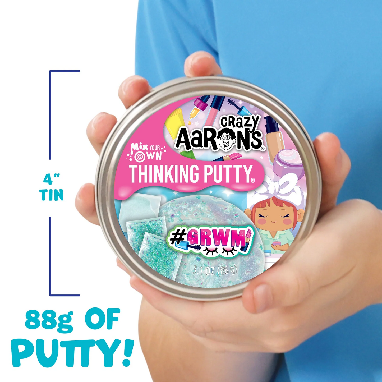 Crazy Aaron's Thinking Putty tin held by a person with text indicating size and weight. Crazy_Aaaron_GRWN_THINKING_PUTTY_