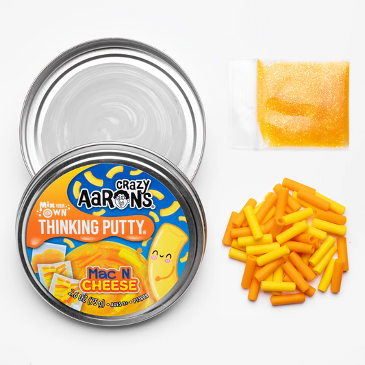 Crazy Aaron's Thinking Putty Mac N Cheese container with putty pieces on a white background