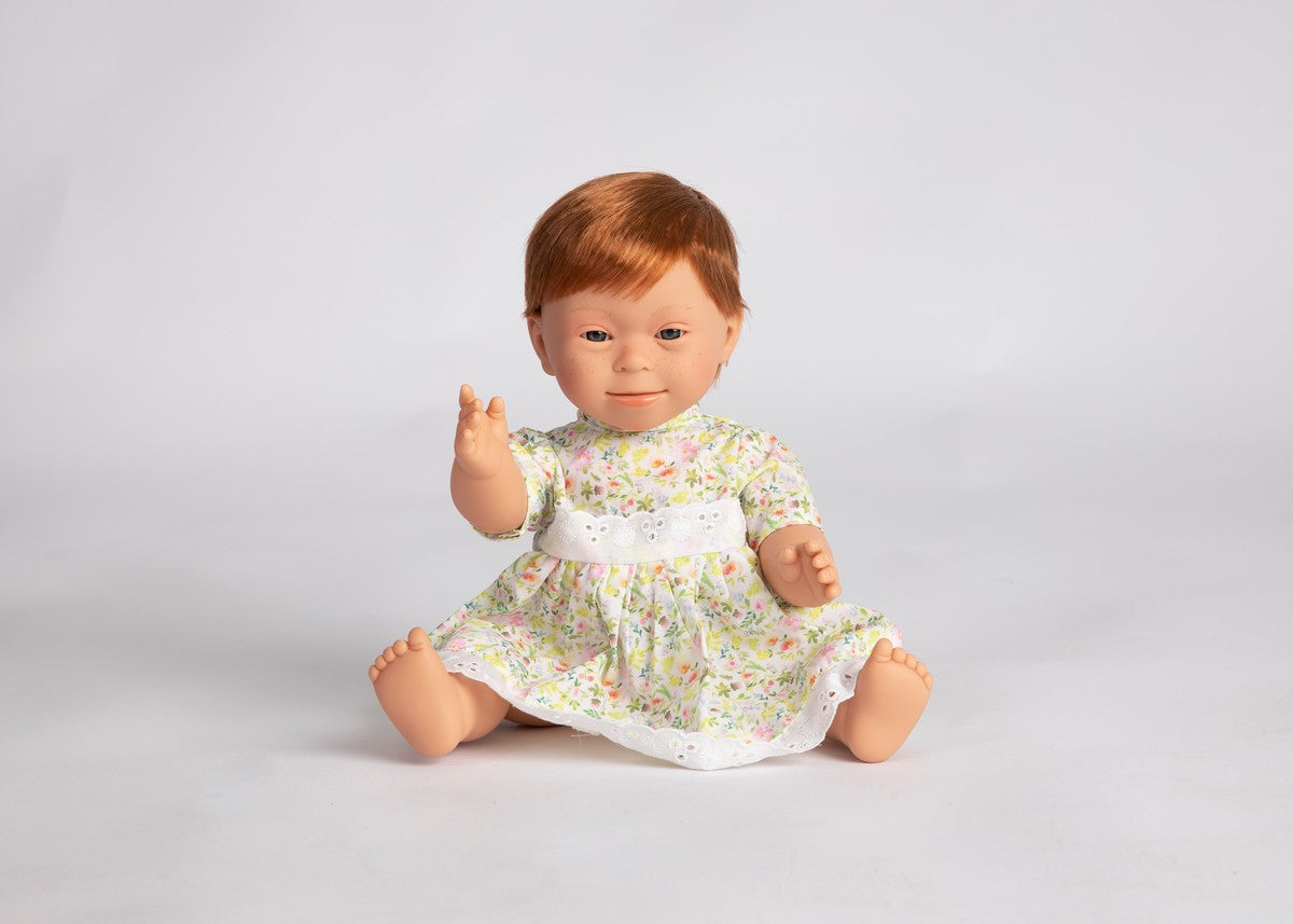 Baby doll with Down syndrome features- girl with short, red hair and freckles