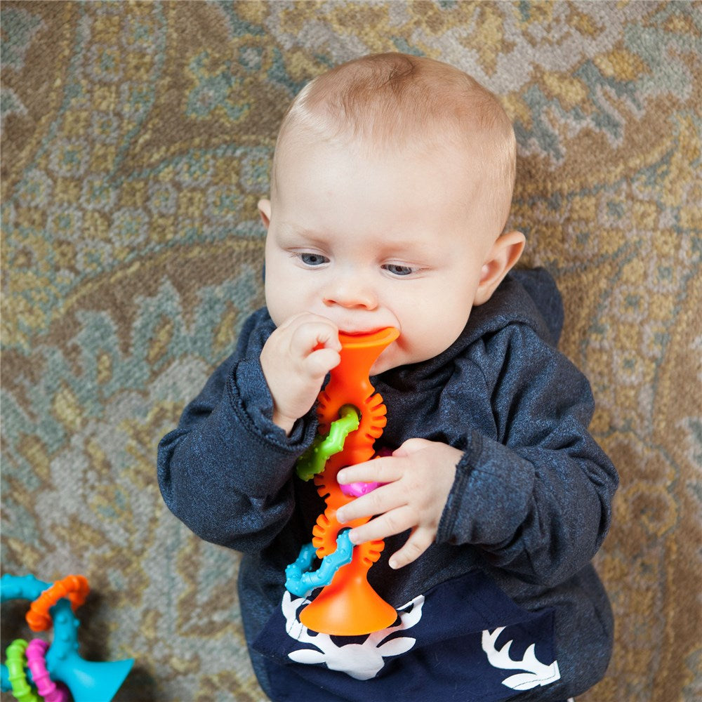 Fat_Brain_Toys_PipSquigzLoops-Orange_baby_chewing