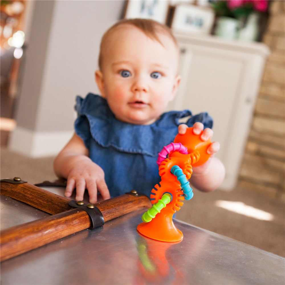 Fat_Brain_Toys_PipSquigzLoops-Orange_baby_playing_in_highchair