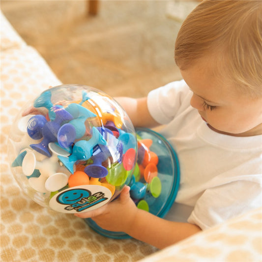 Fat_Brain_Toys_Squigz_Deluxe_set_child_playing_with_the_tub