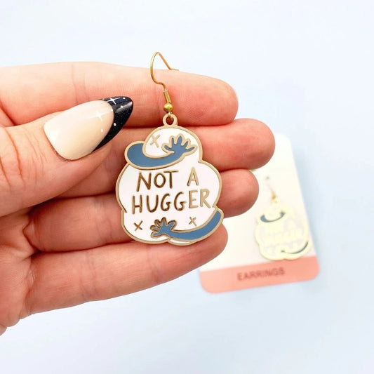 Jubly_Umph_not_a_hugger_earings_in_hand