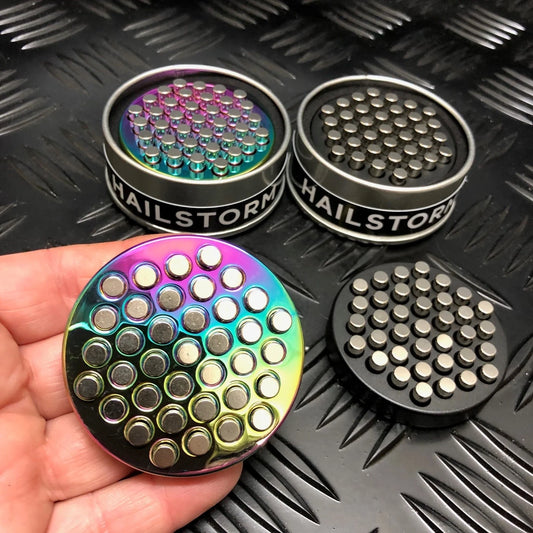 Kaiko_Hailstorm_metal_fidget_oil_slick_in_persons_hand