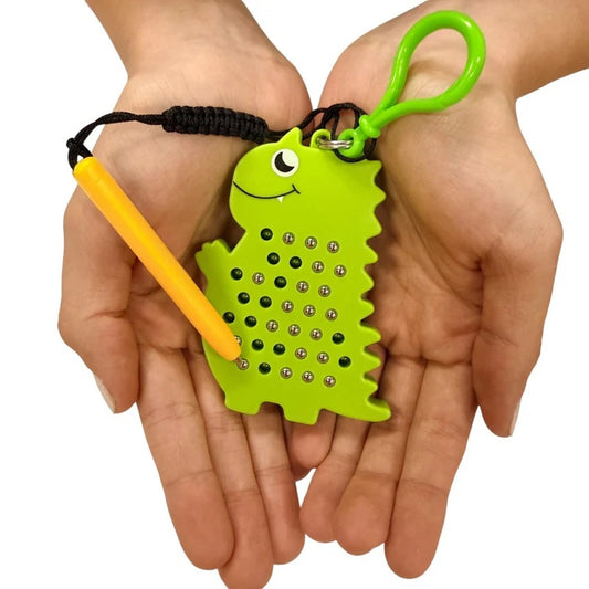 Kaiko_dino_magnetic_pad_keyring_CUPPED_HANDS