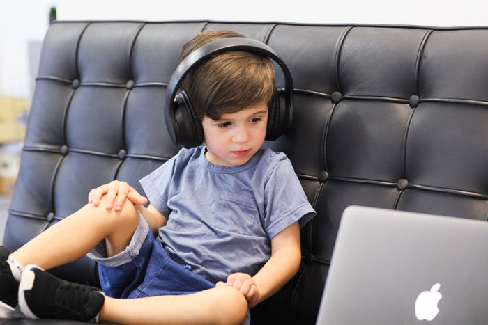 Ems_FOR_KIDS_Blue_Tooth_Head_Phones_CHILD_ON_COUCH