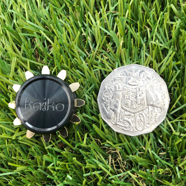 Kaiko_mega_cog_spinner_fidget_next_to_coin