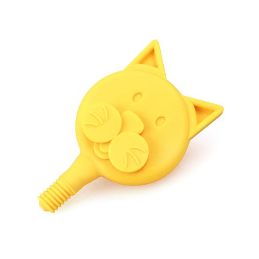 Yellow cat-shaped silicone product on a white background. ARK_Cat_Tip_for_the_Z-Vibe_front_side