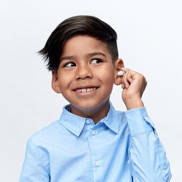 Alpine_Pluggies_Kids_Earplugs_kid_inserting_ear_plug