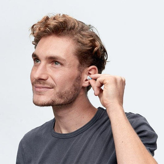 Alpine_Swim_safe_ear_plugs_being_put_into_mans_ears