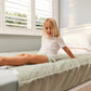 Brolly_Sheets_with_wings_moss_girl_sitting__on_bed_made