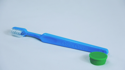 Collis-Curve_Baby_Toothbrush_with_Triplefit_Bristles_green_cap_blue