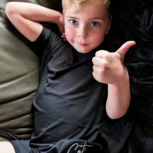 Comfort_on_the_spectrum__boy_wearing_midnight_colour_pyjamas_childrens_sizing