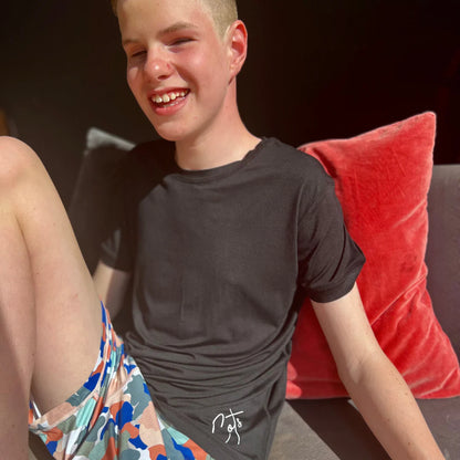Comfort_on_the_spectrum_boy_wearing_camo_pyjamas