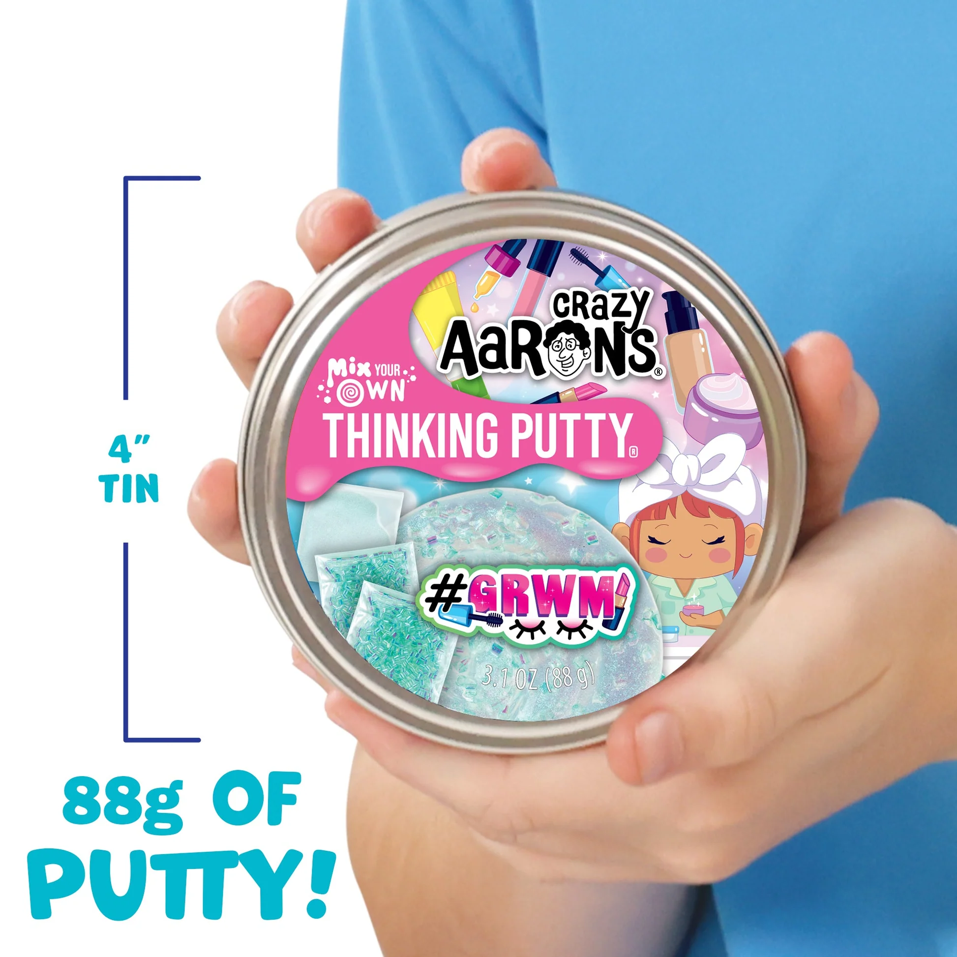 Crazy Aaron's Thinking Putty tin held by a person with text indicating size and weight. Crazy_Aaaron_GRWN_THINKING_PUTTY_