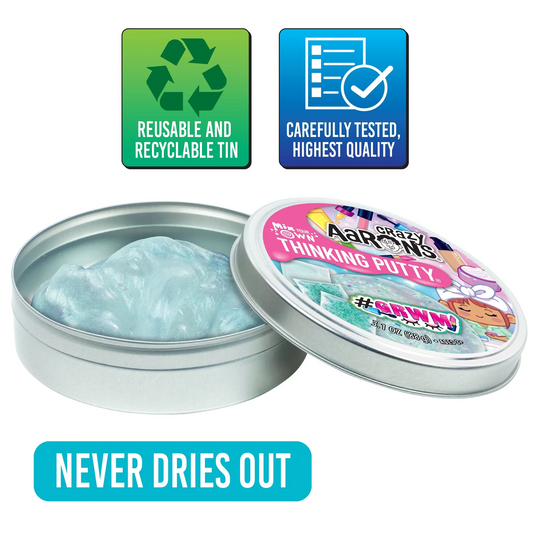 Open tin of Crazy Thinking Putty with 'Never Dries Out' text and quality assurance icons on a white background. Crazy_Aaaron_GRWN_THINKING_PUTTY