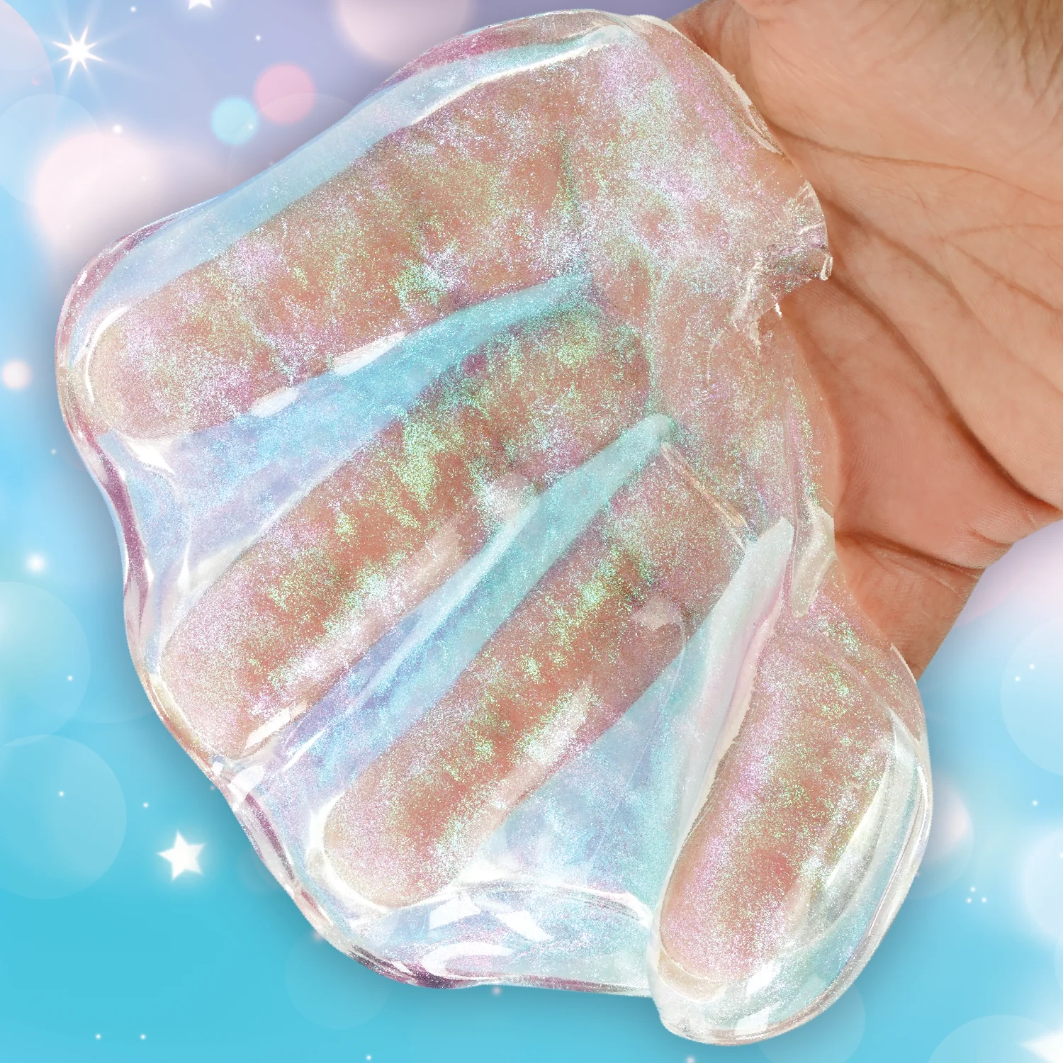 Iridescent gel-like substance held between fingers against a blue background. Crazy_Aaron_Get_ready_with_me_hands_hands
