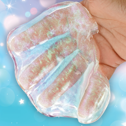 Iridescent gel-like substance held between fingers against a blue background. Crazy_Aaron_Get_ready_with_me_hands_hands