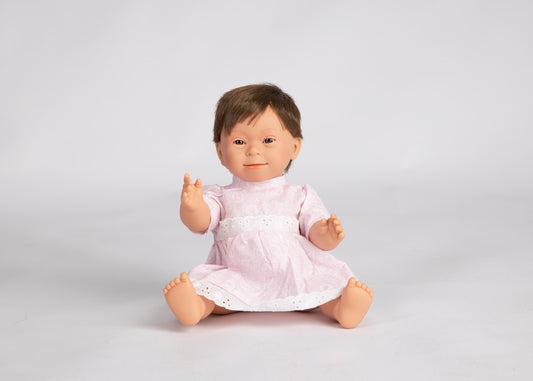 Baby doll with down syndrome features- girl with short, brunette hair