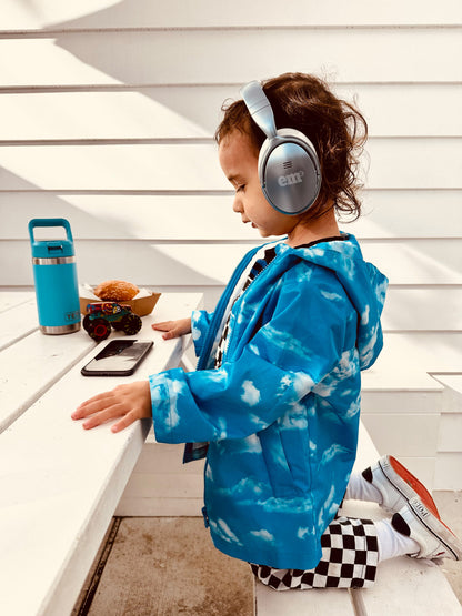 EMS_FOR_KIDS_Active_noise_cancelling_ear_phones_child_wearing_a_pair_ouside