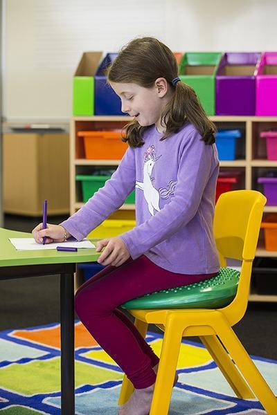 Elizabeth-Richards-Green-WRIGGLE-Cushion-girl-sitting-on