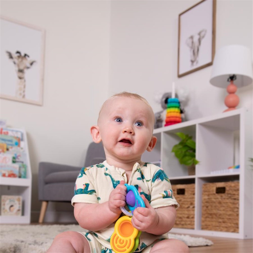 Fat_Brain_Toys_Dimpl_Clutch_baby_playing_with