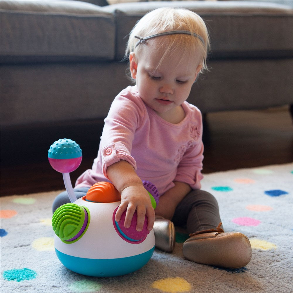 Fat_Brain_Toys_Klickity_small_girl_playing_with_product