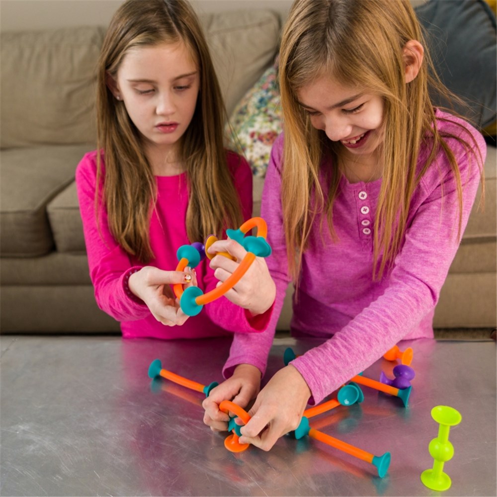Fat_Brain_Toys_Squigz_Toobz_girls_creating_builds