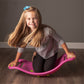 Fat_Brain_Toys_Teeter_Popper_Girl_kneeling_in_teeter_popper_pink