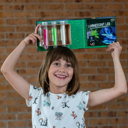 Heebie_Jeebies_Luminescent_Science_Lab_child_with_gift