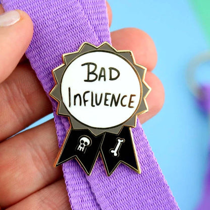Jubly-Umph_Bad_influence_lapel_pin_on_purple_lanyard