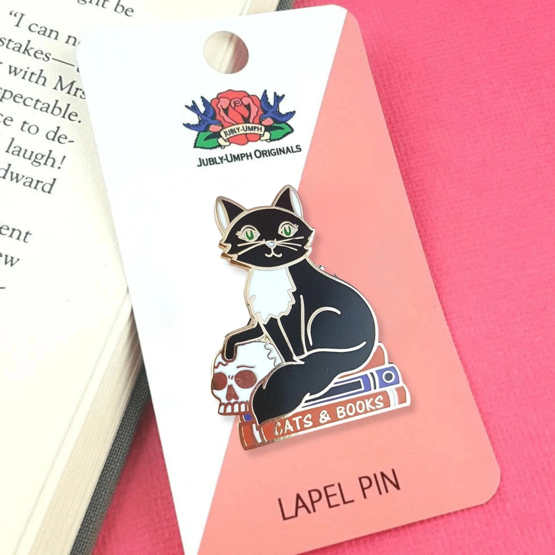 Jubly-Umph_Cats_and_Books_on_cardboard_packaging_background