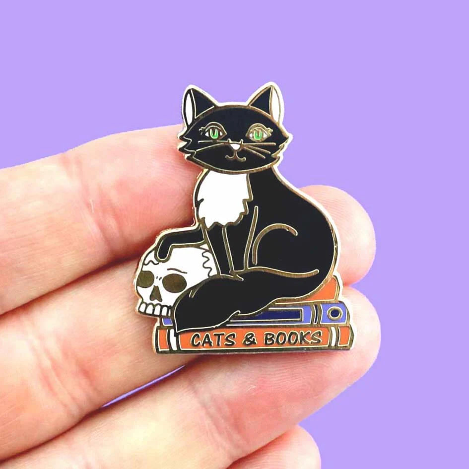 Jubly-Umph_Cats_and_Books_on_persons_hand