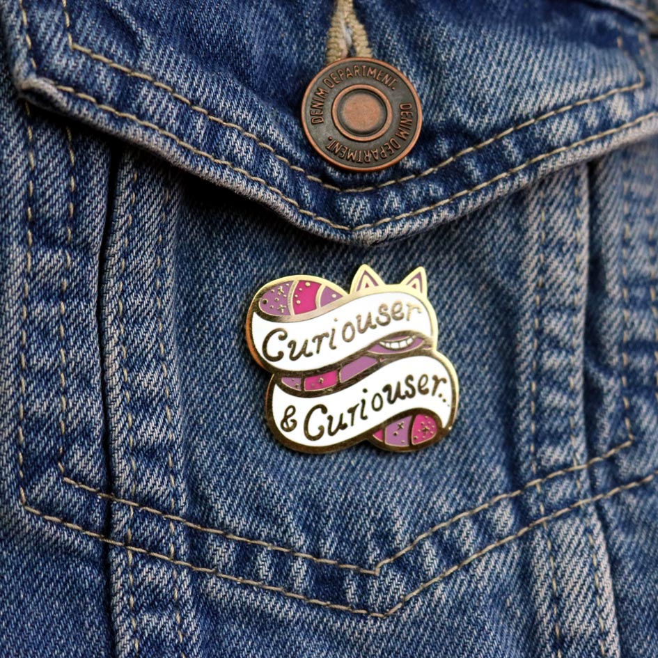 Jubly-Umph_Curioser_and_Curioser_lapel_pin_on_denim_jacket