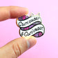 Jubly-Umph_Curioser_and_Curioser_lapel_pin_on_pale_background