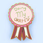 Jubly-Umph_Doing_my_Okayest_lapel_pin_origional_on_pale_blue_background