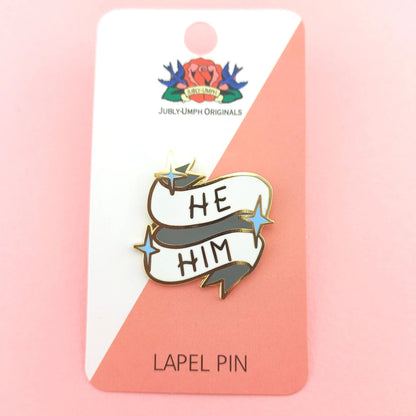 Jubly-Umph_He_Him_Lapel_pin._on_cardboard_backing