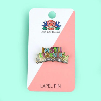 Jubly-Umph_I_m_still_learning_enamel_pin_on_backing