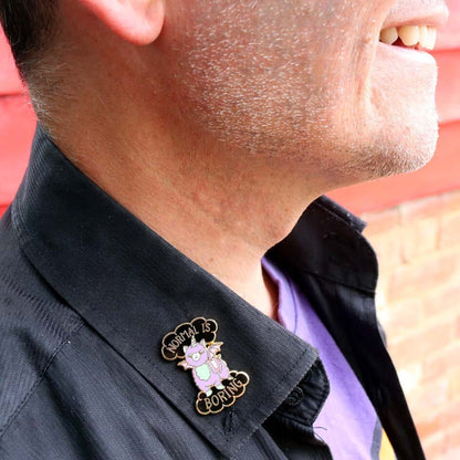 Jubly-Umph_Normal_Is_Boring_Lapel_Pin_on_mans_black_collar