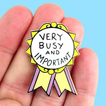 Jubly-Umph_Very_busy_and_important_Lapel_pin_on_persons_hand