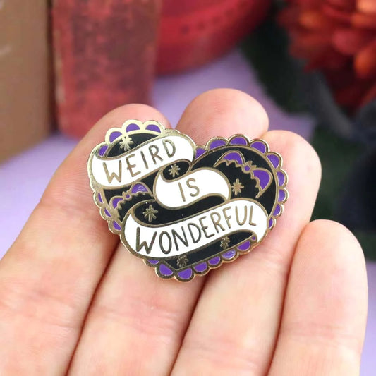 Jubly-Umph_Weird_Is_Wonderful_Lapel_Pin_on_persons_hand