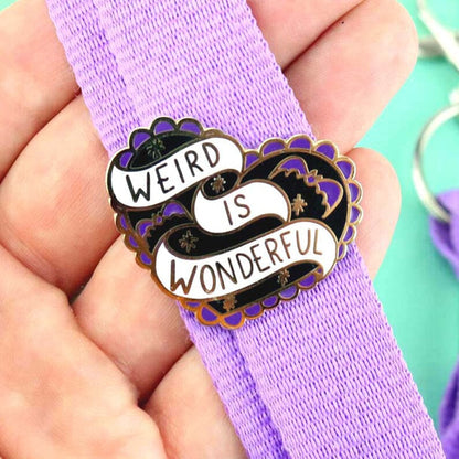 Jubly-Umph_Weird_Is_Wonderful_Lapel_Pin_on_purple_bag_strap
