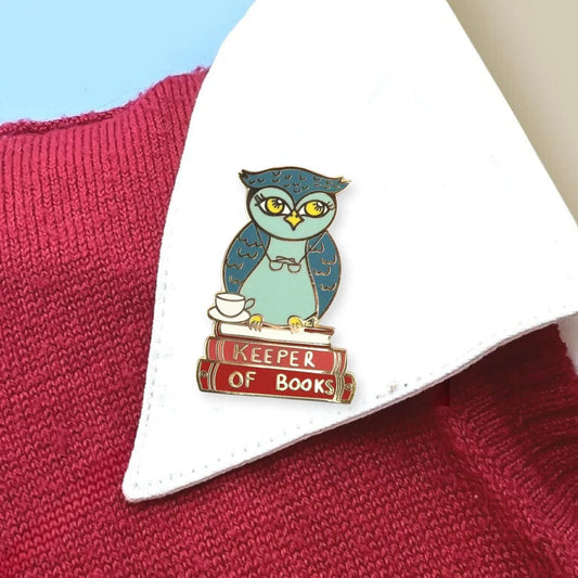 Jubly-Umph_keeper_of_books_lapel_pin_on_collar_of_shirt