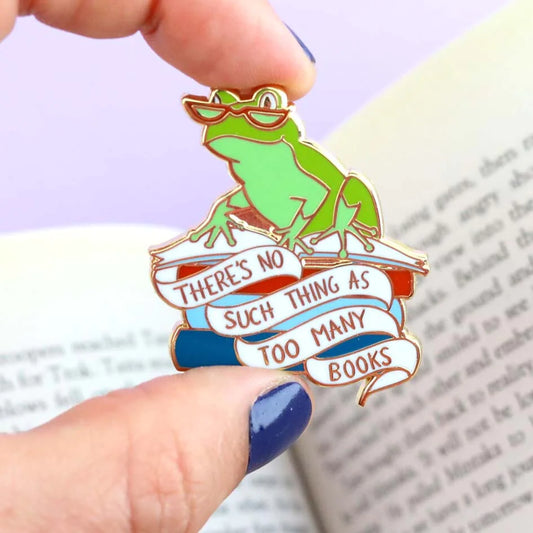 Jubly-Umph_theres_no_such_thing_as_too_many_books_lapel_pin_pinched_between_two_fingers