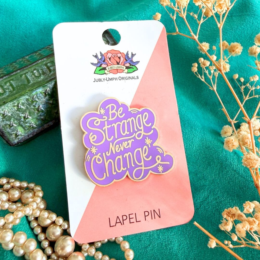 ubly_Umph_Be_Strange_never_change_Lapel_pin_on_card