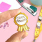 Jubly_Umph_Chaos_Personified_Lapel_Pin_in_fingers