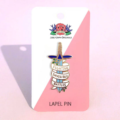 Jubly_Umph_Fighting_Invisible_battles_Lapel_pin_on_packaging