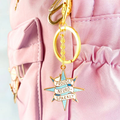 Jubly_Umph_KeyChain_Proudly_neuro_sparkly_on_bag