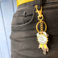 Jubly_Umph_Keychain_very_busy_and_important_clipped_to_black_jeans